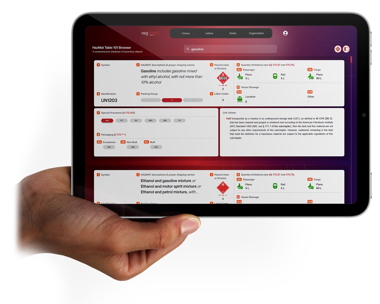 Hand holding tablet displaying RegLogic application at a shipping dock